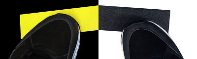 Dos cintas antideslizantes pegadas al suelo, una amarilla y una negra con zapatos encima